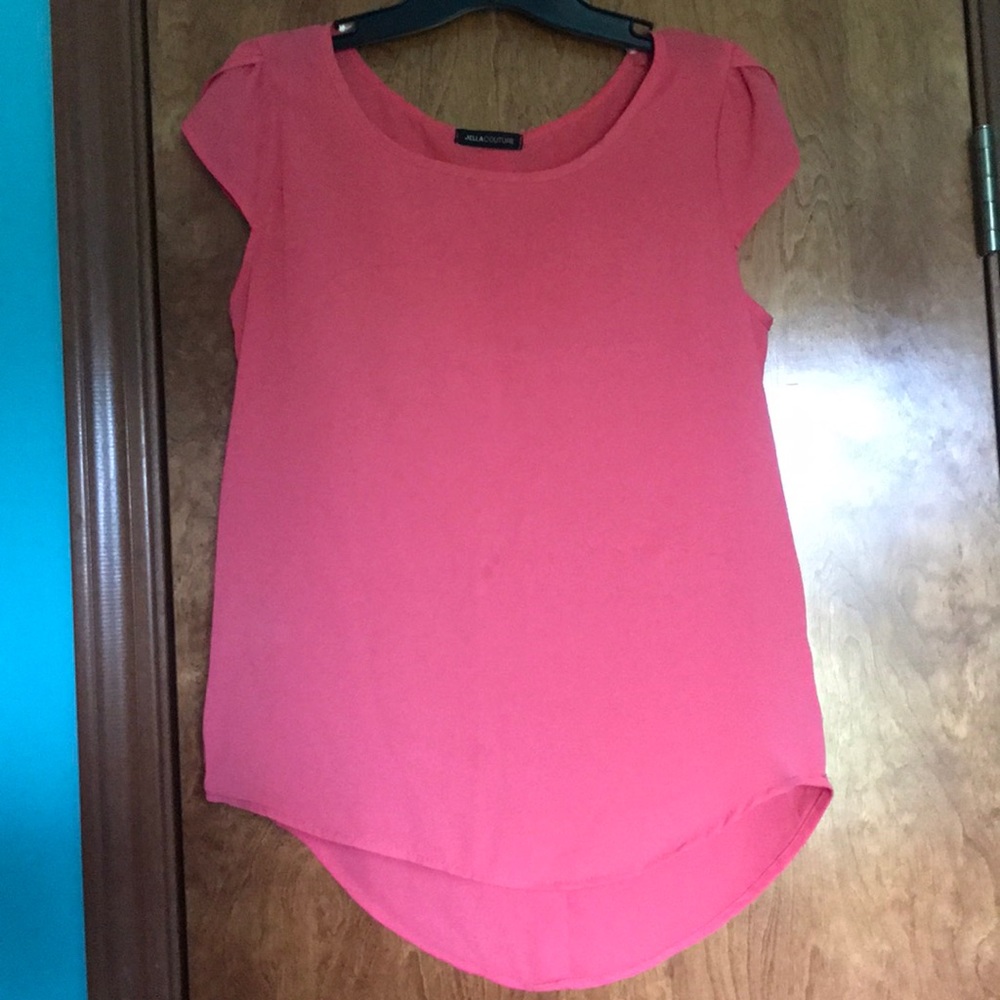 Pink/coral blouse.